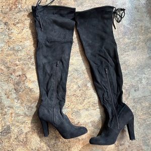 Black heeled thigh high boots